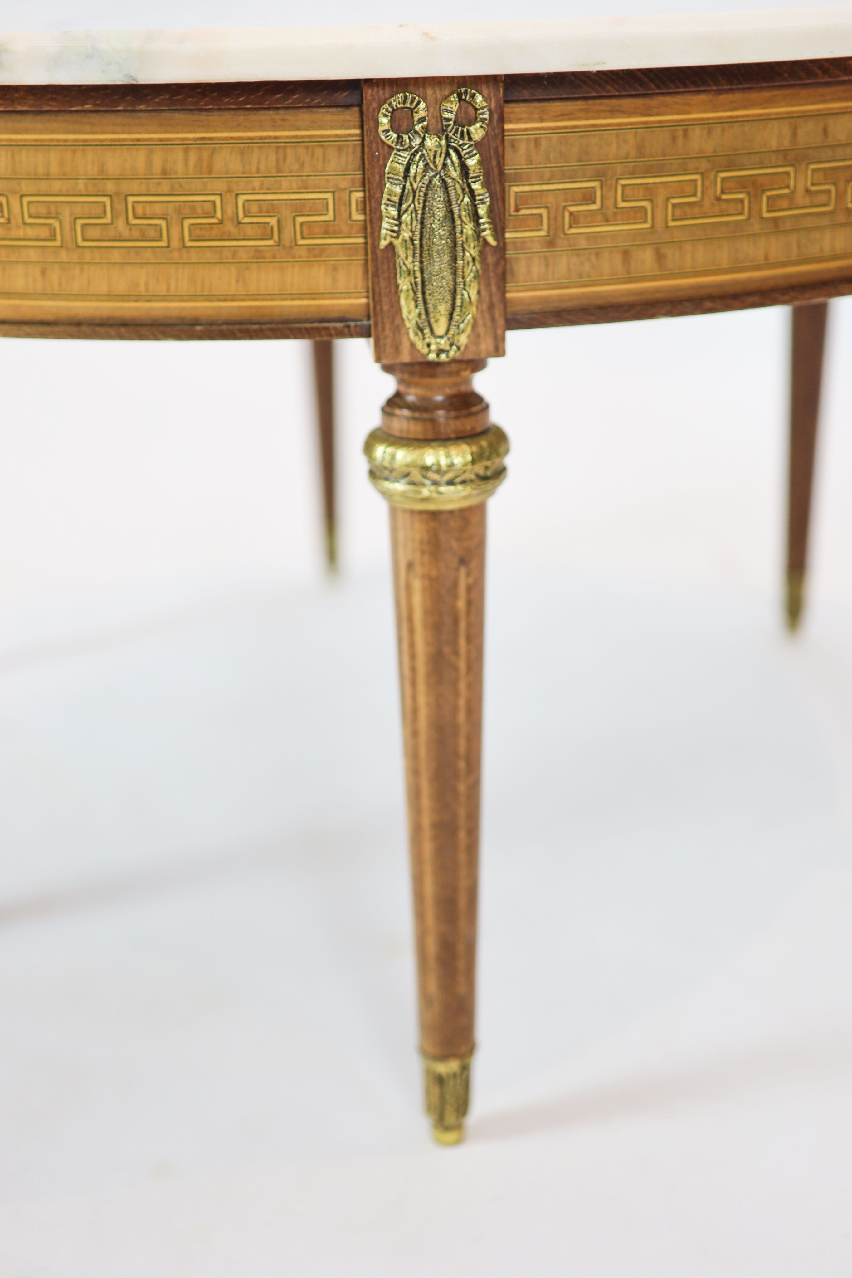 A Louis XVI inlaid mahogany circular marble topped table, diameter 86cm, height 46cm